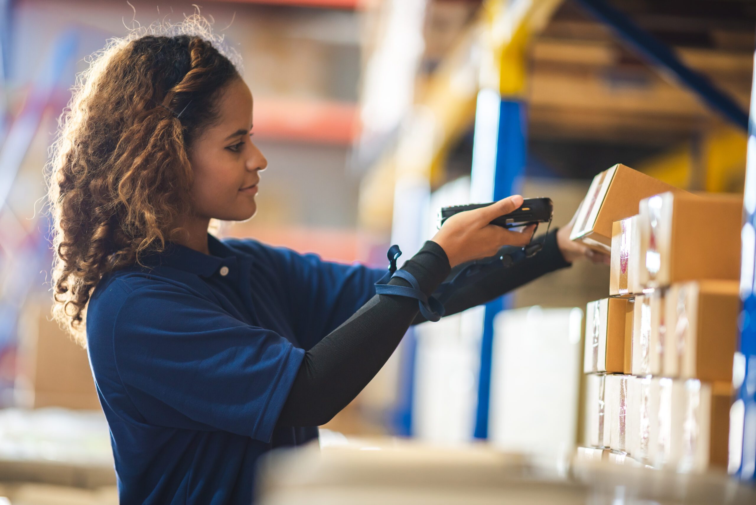 warehouse worker using lot control software